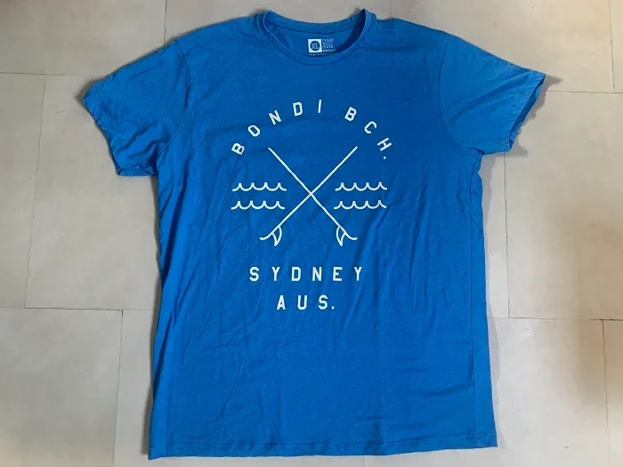 オーストラリア 90s シドニーBONDAI BCH(ボンダイ・ビーチ) ブルー ホワイト ヴィンテージ Tシャツ 古着 XLサイズ 【オランダから直送】